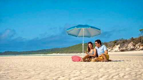 A happy timeout at Whitehaven Beach with a boat-ride on aquamarine waters