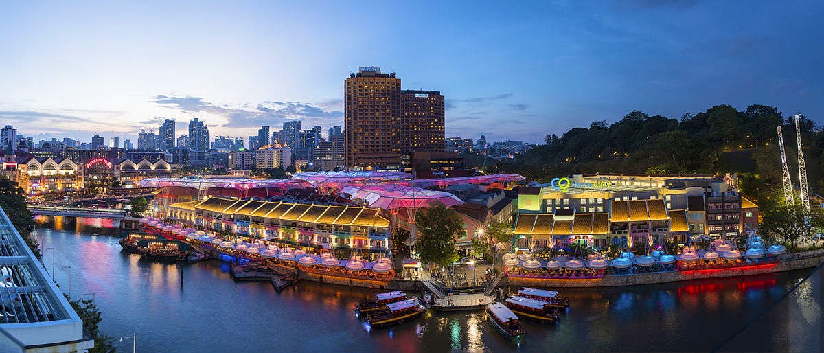 Leisurely time out heading to floating pubs and restaurants at the historical riverside quay in Singapore - Clarke Quay